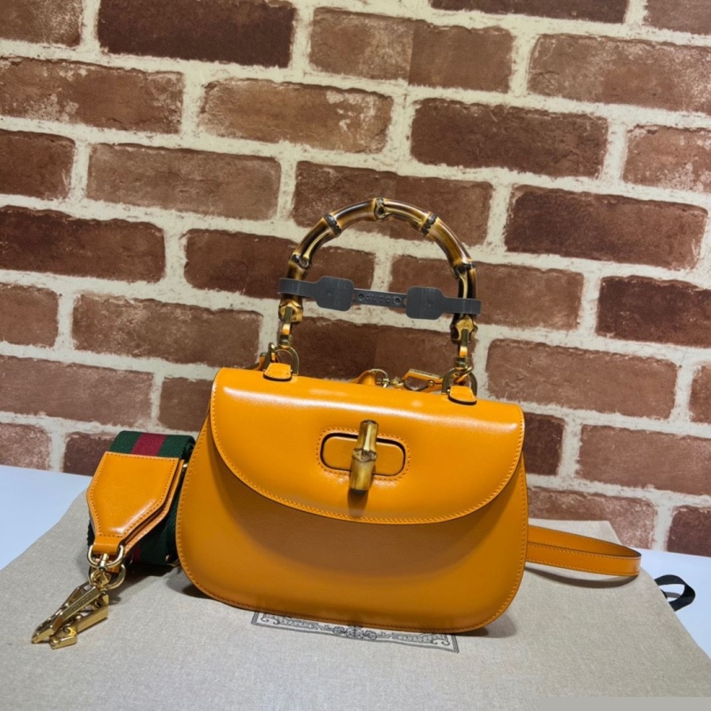 G*u*i top handle bags